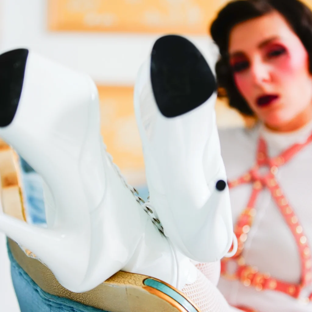 close up of mistress obelia'a boots from a slave's perspective